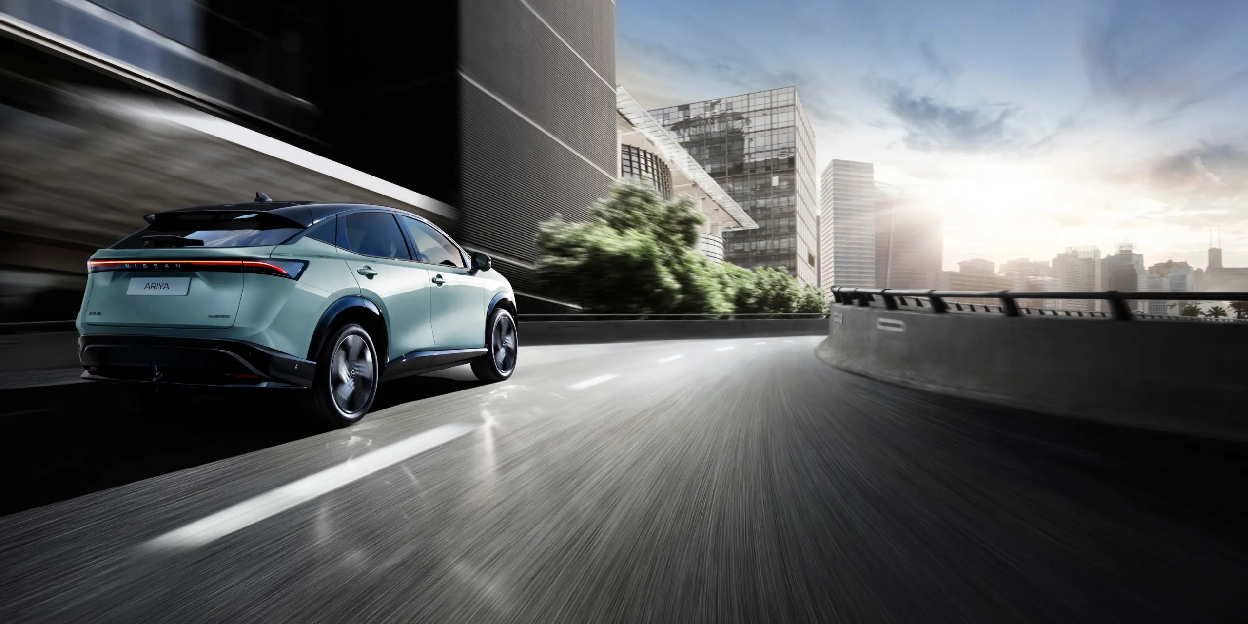 SUV 100% Electric Nissan ARIYA rear view in city
