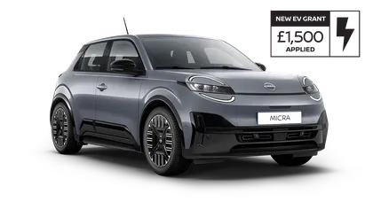 A sleek, modern gray car with a compact design, featuring a distinctive front grille and stylish alloy wheels.