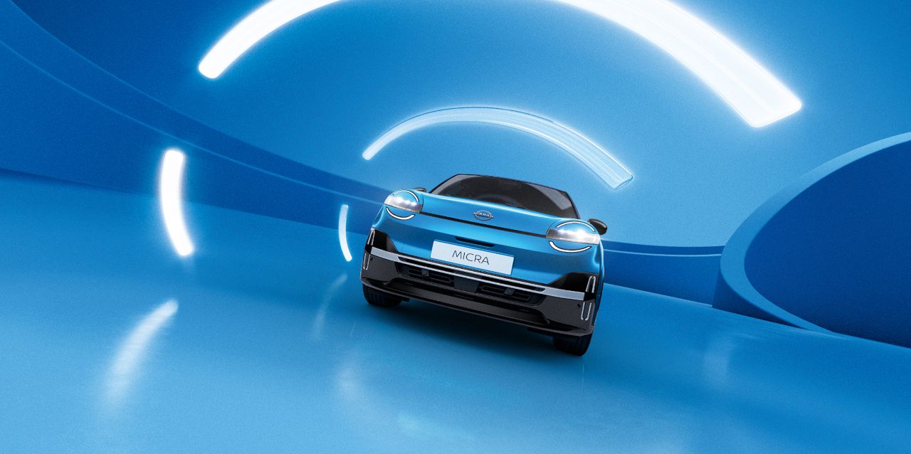 front view of the All-New Nissan MICRA on a road in a dark blue background